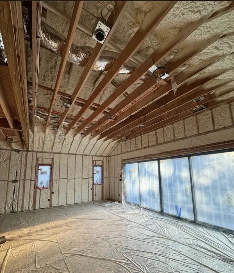 Interior walls and ceiling insulated with spray foam during new construction in Fallsburg